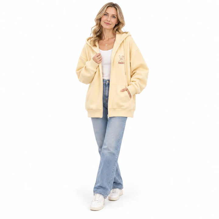 Apricot Yellow rabbit zip hoodie worn by an adult woman, with long sleeves and rabbit embroidery, against a white background.