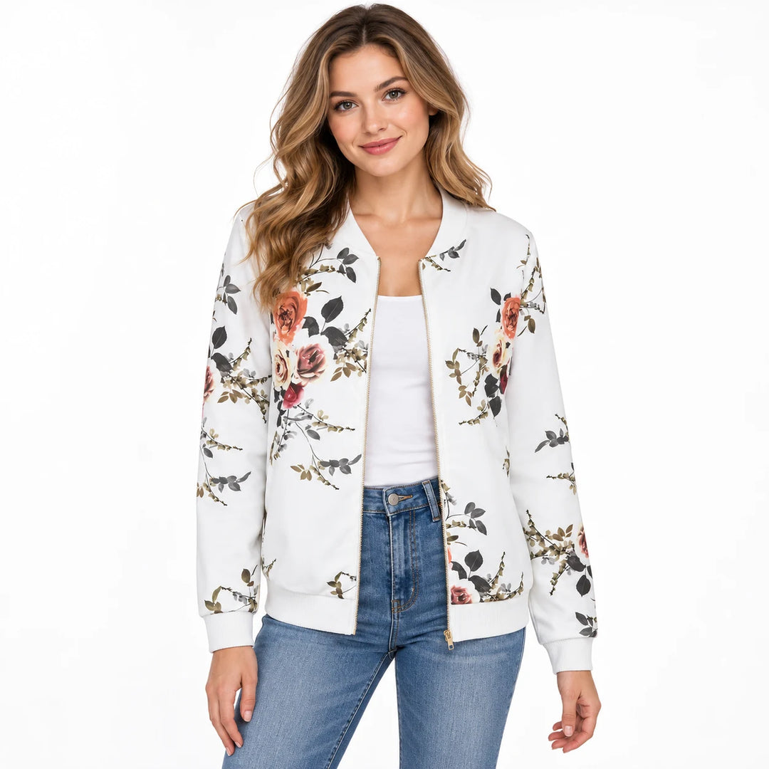 Model wearing the White floral bomber jacket with a white top and blue jeans showing the rose print and matching ribbed trim.