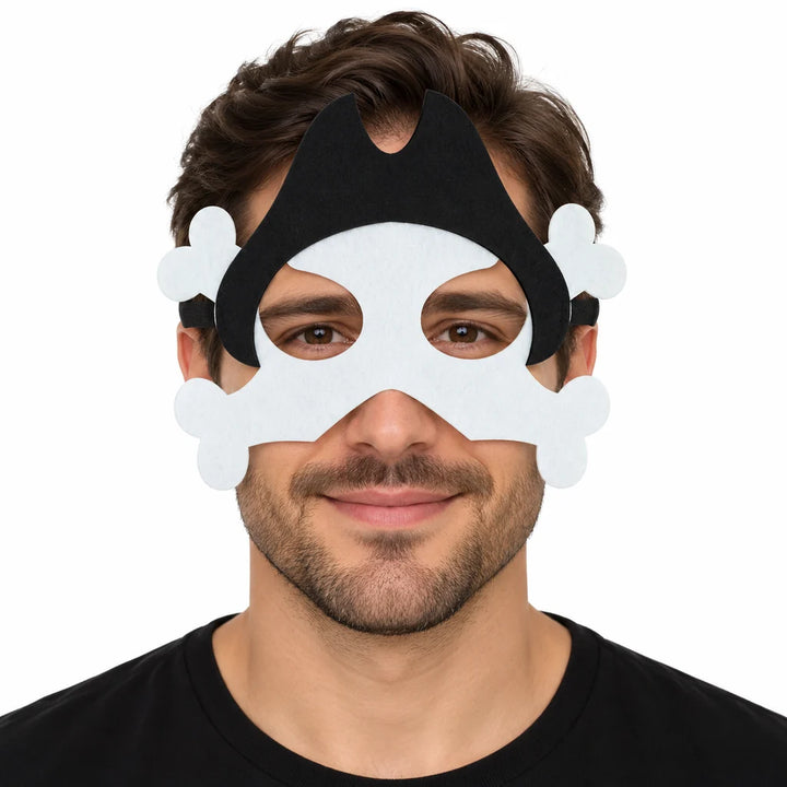 Adult male model wearing a white pirate bones felt mask with black hat silhouette and crossbones on a white studio background
