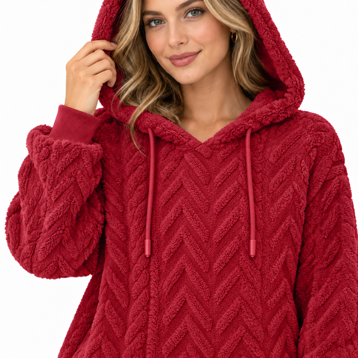 Close view of the red hoodie neckline, textured fabric and hood drawstrings. This textured fabric is shown for a closer look.