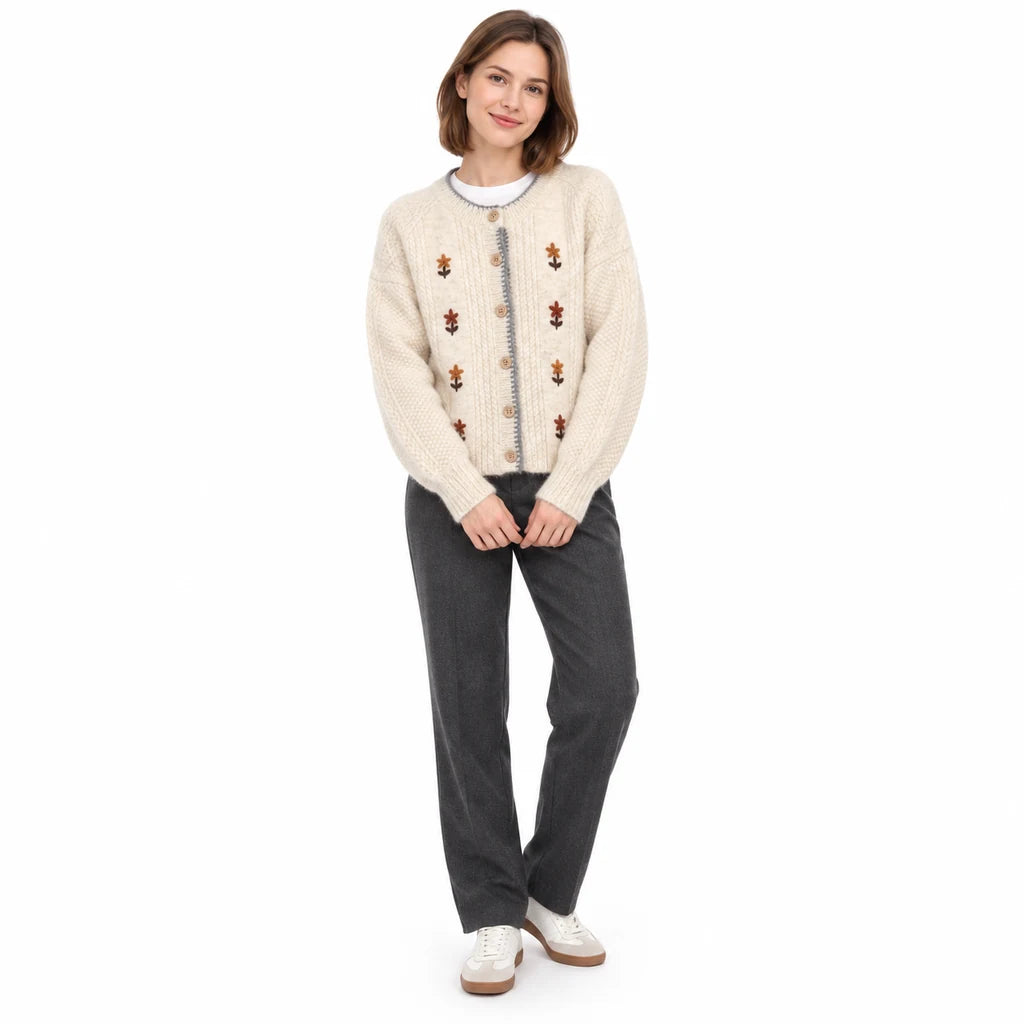 Ivory Floral cardigan sold variant viewed on a full-length model, with a button front, round neck and long sleeves in studio.