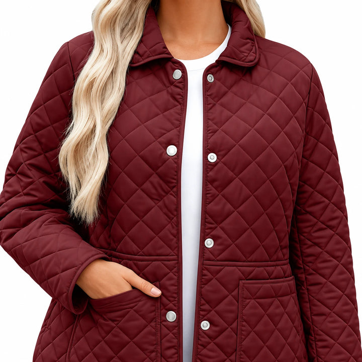 Wine Red jacket close-up displaying its folded collar, silver front snaps, diamond quilting and a model&