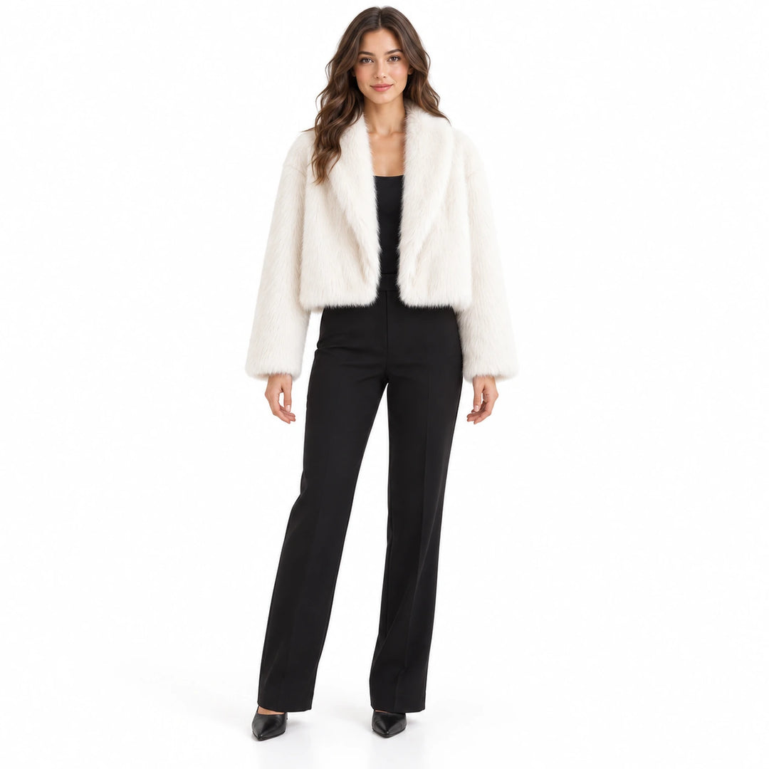 Cropped faux fur jacket in white worn by a full-body adult model with a black top and trousers against a soft white backdrop.