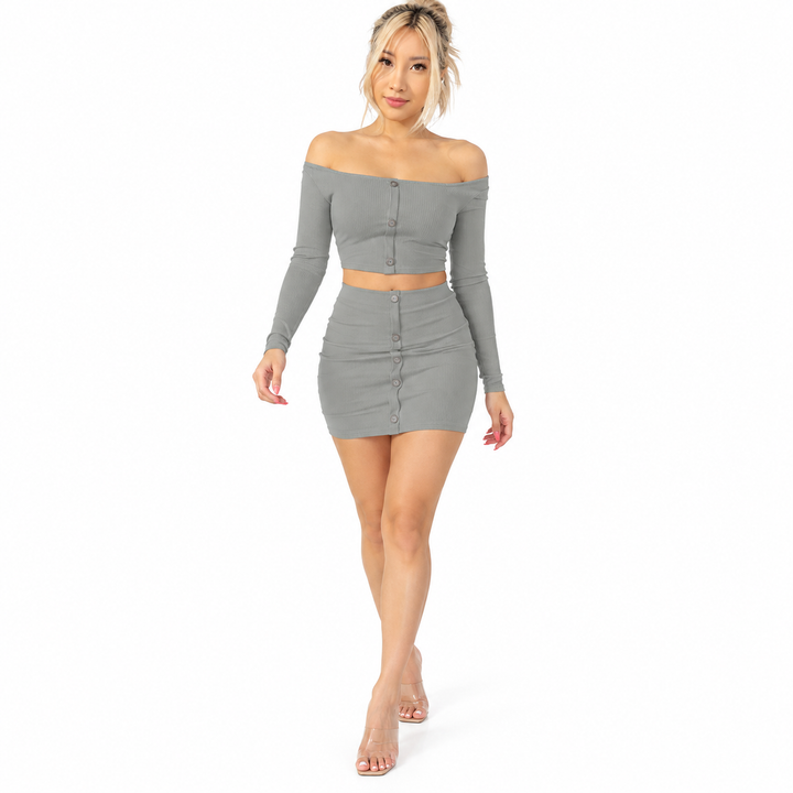 Grey long sleeve crop top and matching mini skirt on a walking model