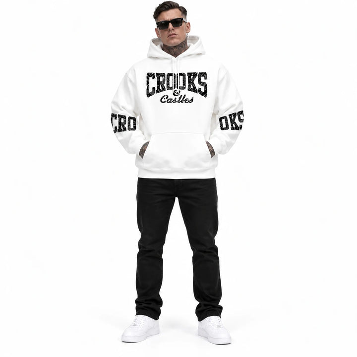 Full-length male model wearing a White graphic hoodie with chest and sleeve prints on a white studio background
