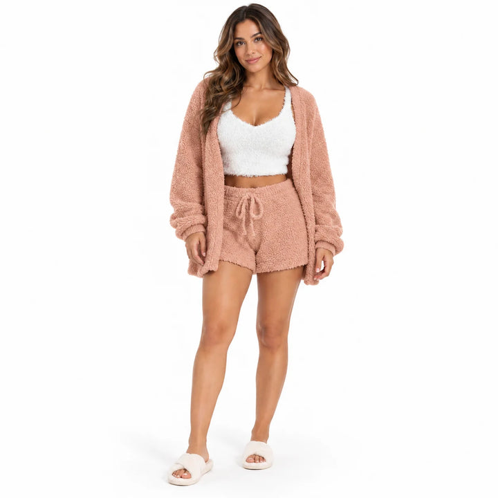 Full-body model in peach lounge coat and drawstring shorts with a white cropped vest, front view on a plain white background.