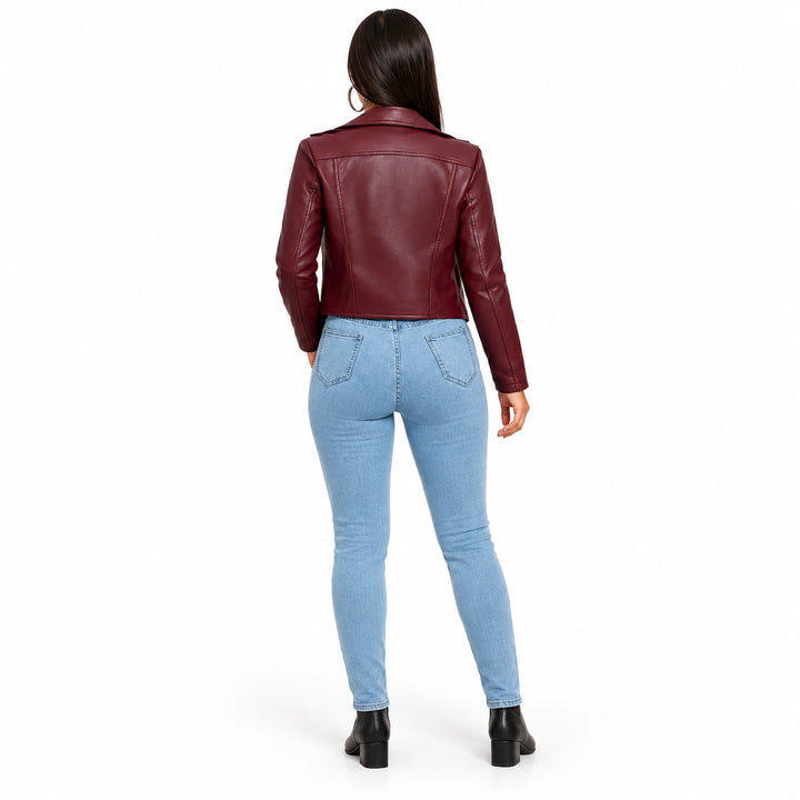 Burgundy moto jacket in a rear view on a full-body model, showing the shoulder yoke, fitted back panels and waist-length hem.