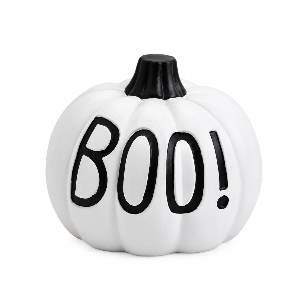 White Halloween pumpkin with black BOO! lettering, molded vertical grooves and a short black stem on a white studio backdrop.