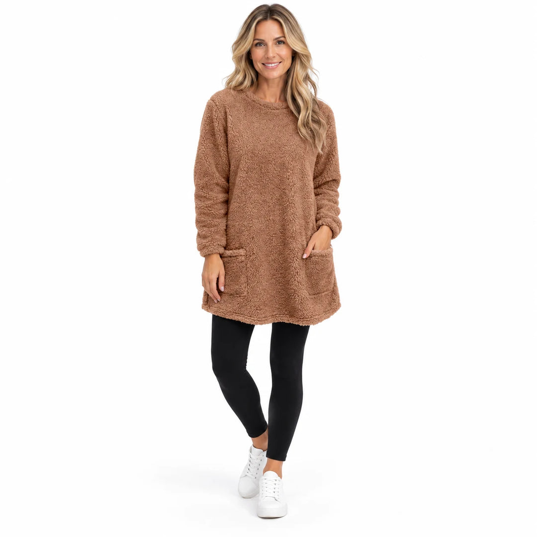 Brown long fleece pullover worn by an adult woman, showing the round neckline and fleece texture, against a white background.