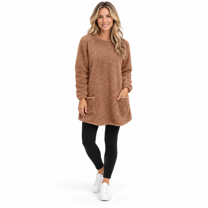 Brown long fleece pullover worn by an adult woman, showing the round neckline and fleece texture, against a white background.