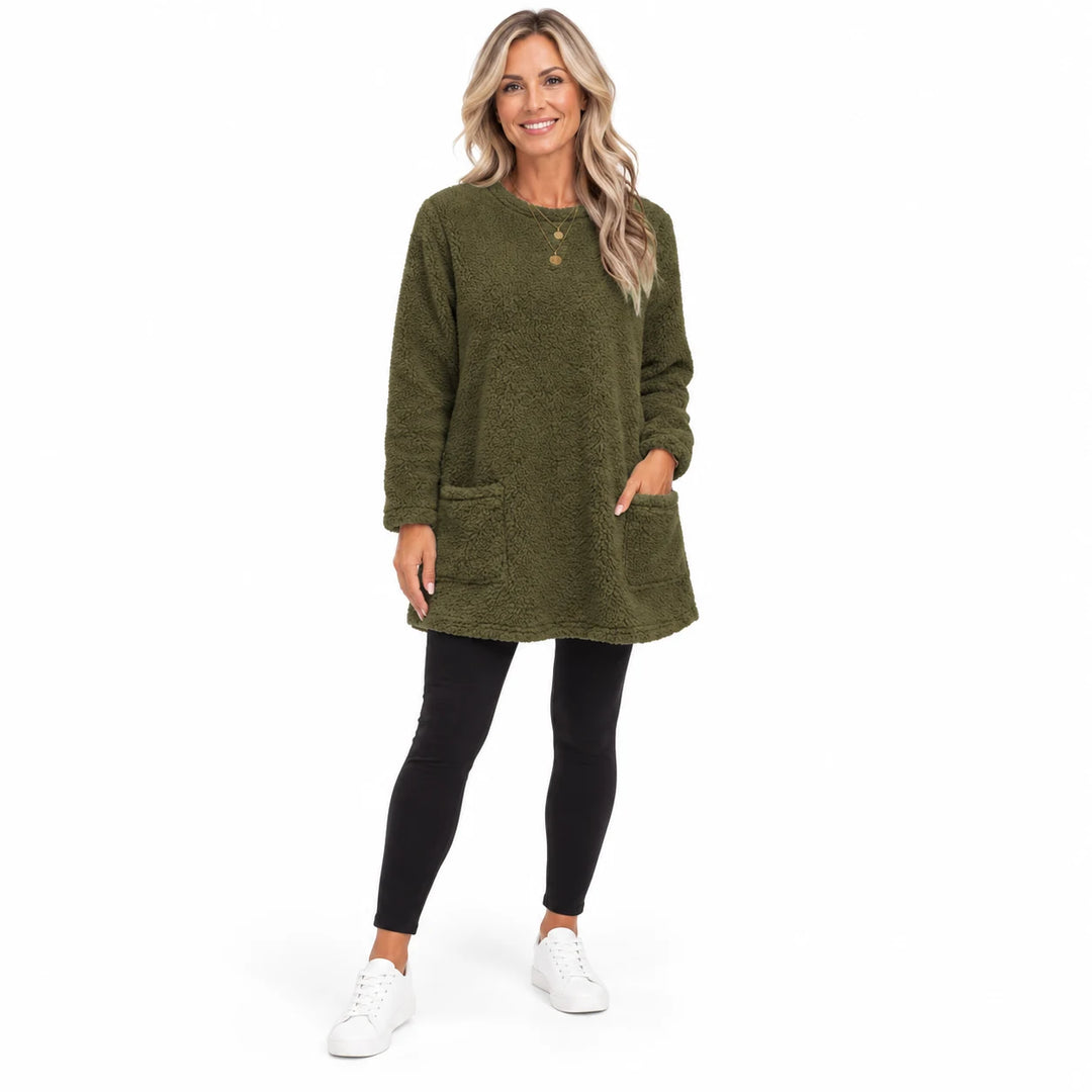 Army Green long fleece pullover worn by an adult woman, with a round neck and front patch pockets, in a white studio setting.