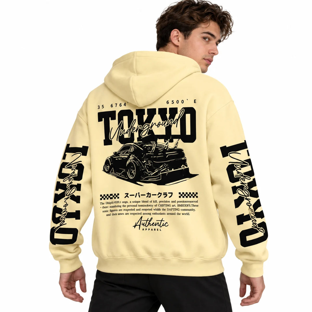 Male model wearing Pale Yellow Tokyo racing graphic hoodie, showing back artwork and sleeve prints
