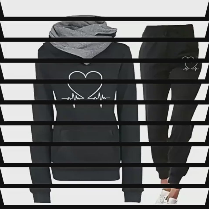 women's love heart printed sports suit hood up view on model in green color showcasing cozy design and long sleeve comfort for cooler days