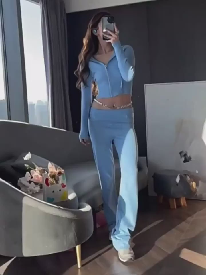 two piece set women blue knit hoodie zip front with splicing detail and coordinated long pants folded for packing