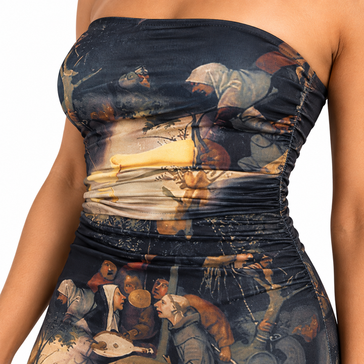 Close-up of the printed fabric, strapless top edge and waist detail on the fitted short dress.