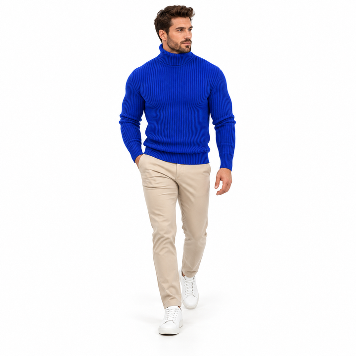 Sapphire blue turtleneck styled with beige trousers in a full-body walking pose.