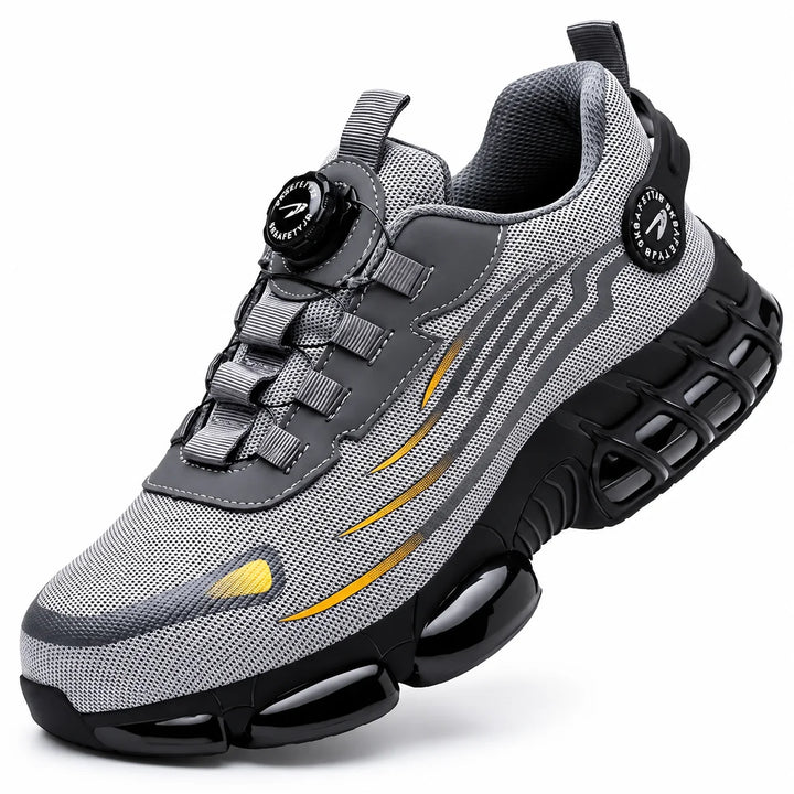 Grey athletic steel toe shoe with mesh upper and black sculpted sole on a white background.
