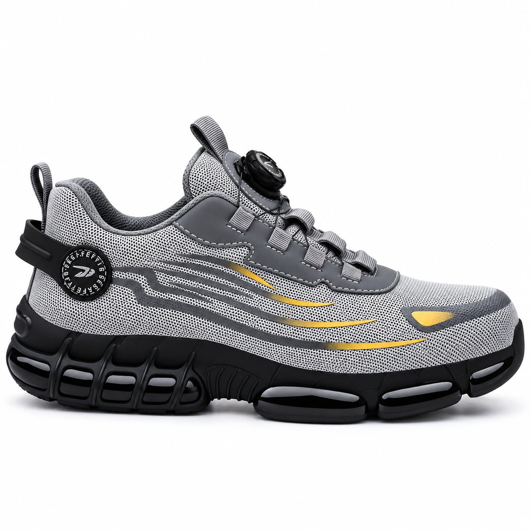 Side profile of a grey athletic steel toe shoe with yellow accents and a black segmented outsole.