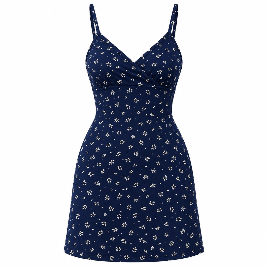 Navy blue mini dress with a small light botanical print, wrap V neckline and thin straps, shown on white.