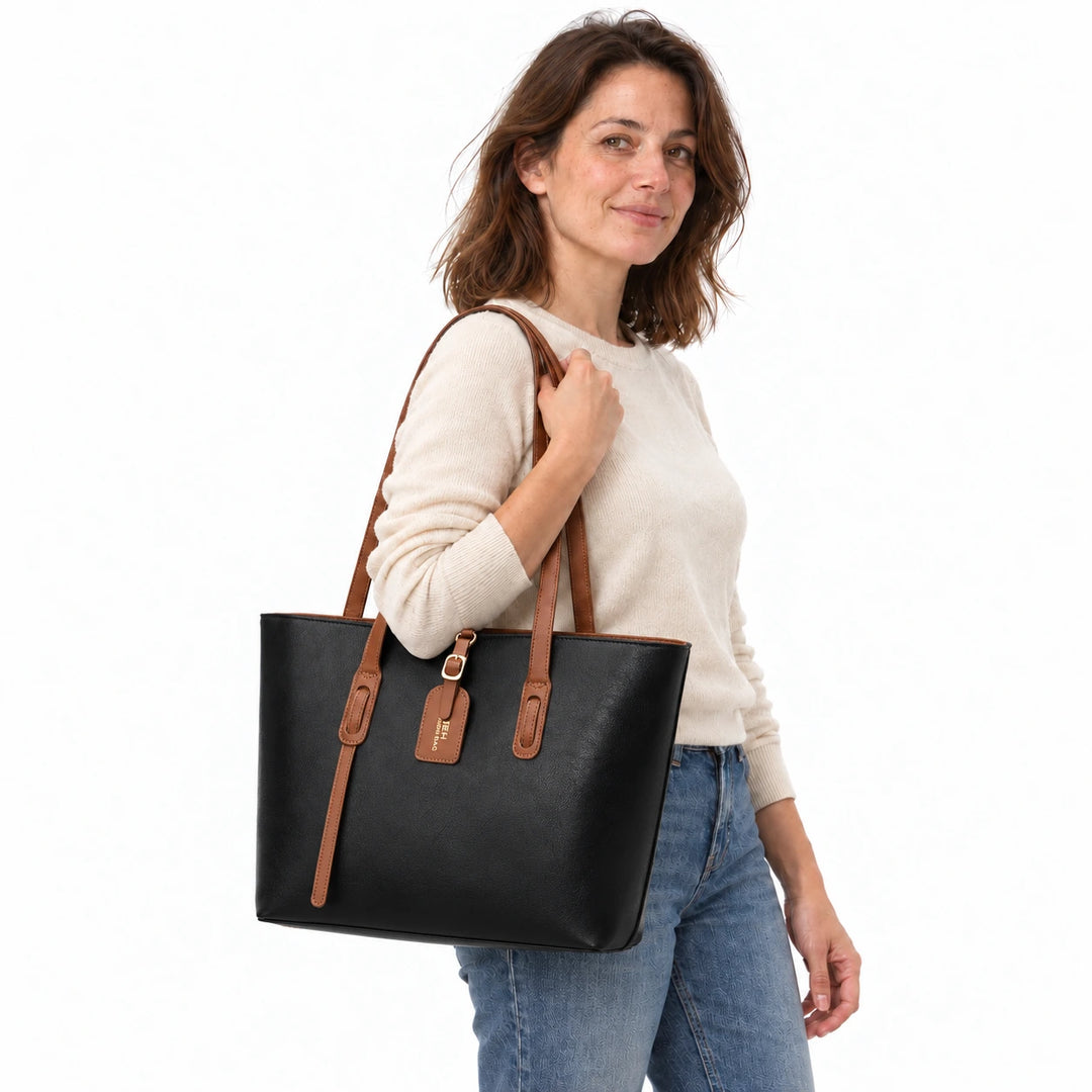 Model carrying the Black PU bucket shoulder bag with brown handles