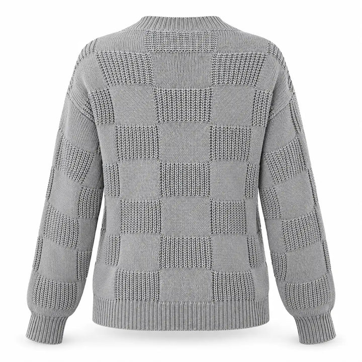 Back view of the gray openwork checkerboard knit sweater