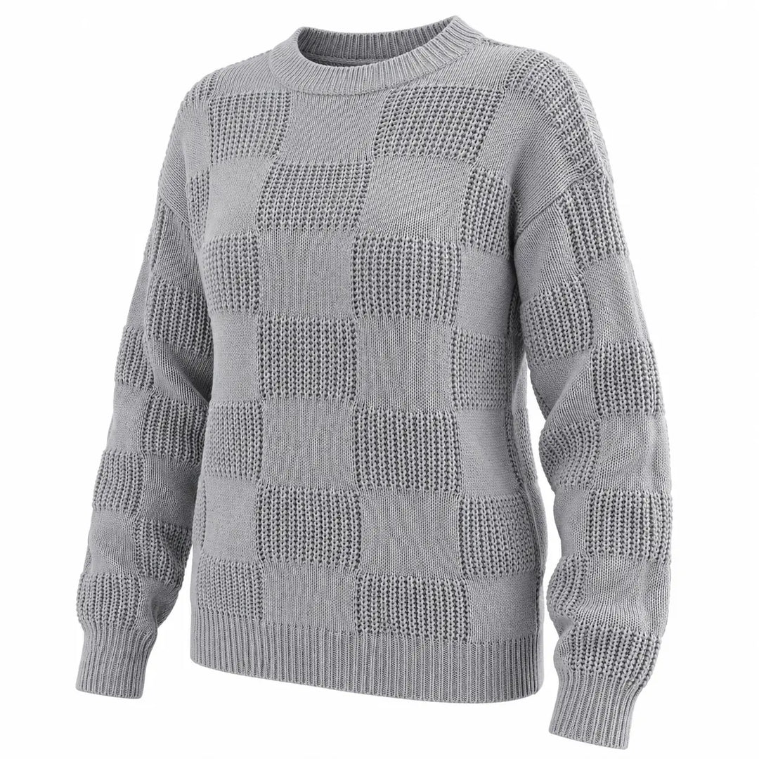 Three-quarter view of the gray checkerboard knit sweater showing its shape and knit texture