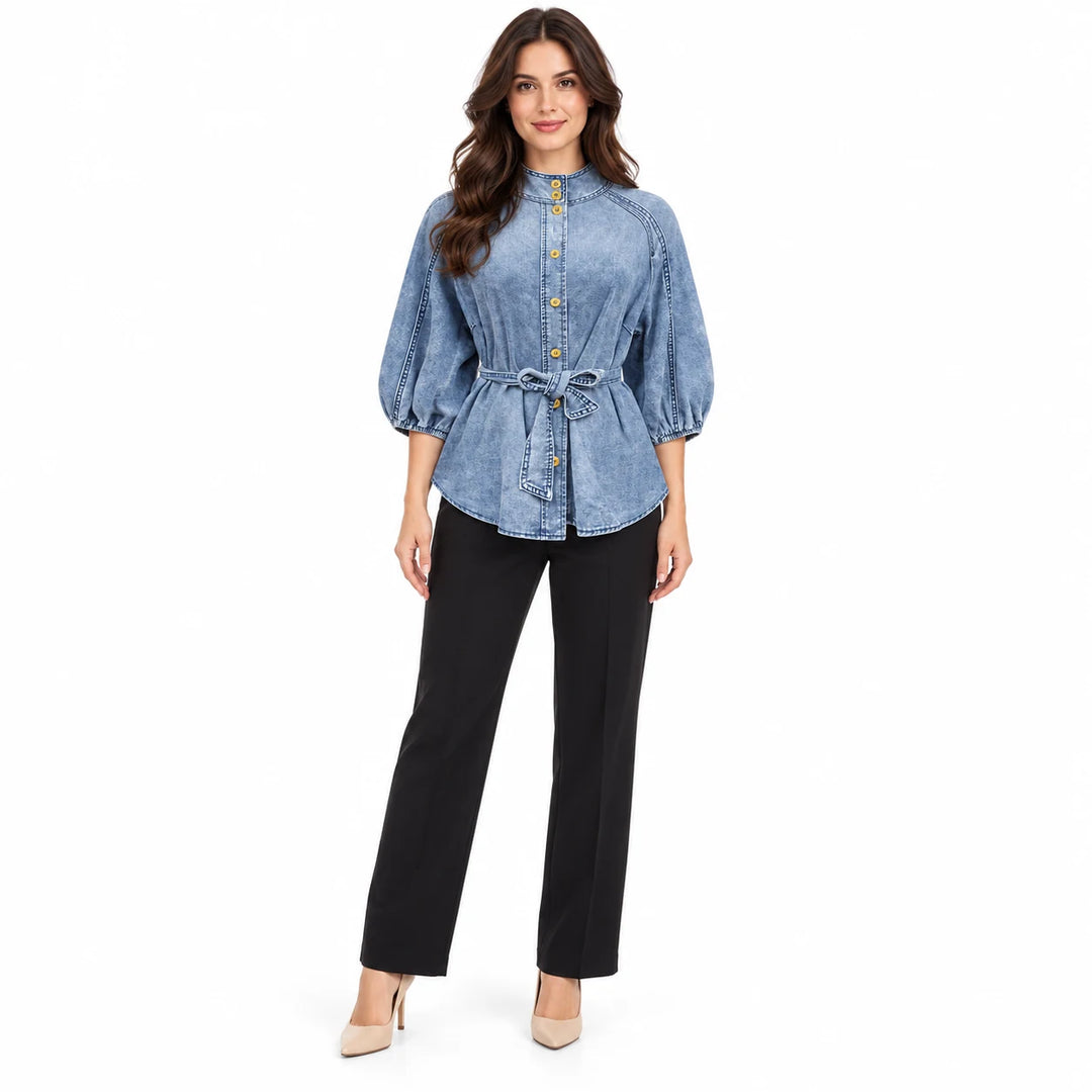 Denim puff sleeve top in Washed Blue T0308 on a front-facing adult model, with yellow buttons and a matching tied waist belt.