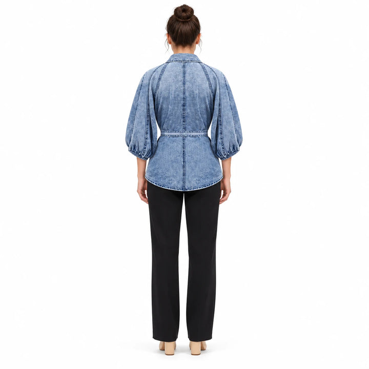 Washed Blue T0308 blouse on an adult model from the back, showing raglan seams, gathered sleeve cuffs and the waist tie band.