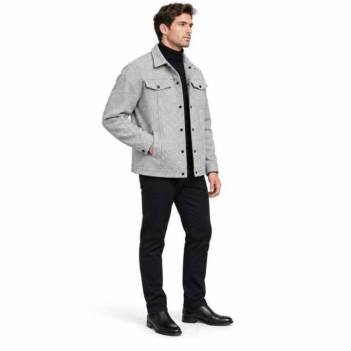 Light gray jacket on a full-body adult male model in a side view, showing collar, chest flap pockets and snap cuffs on white.