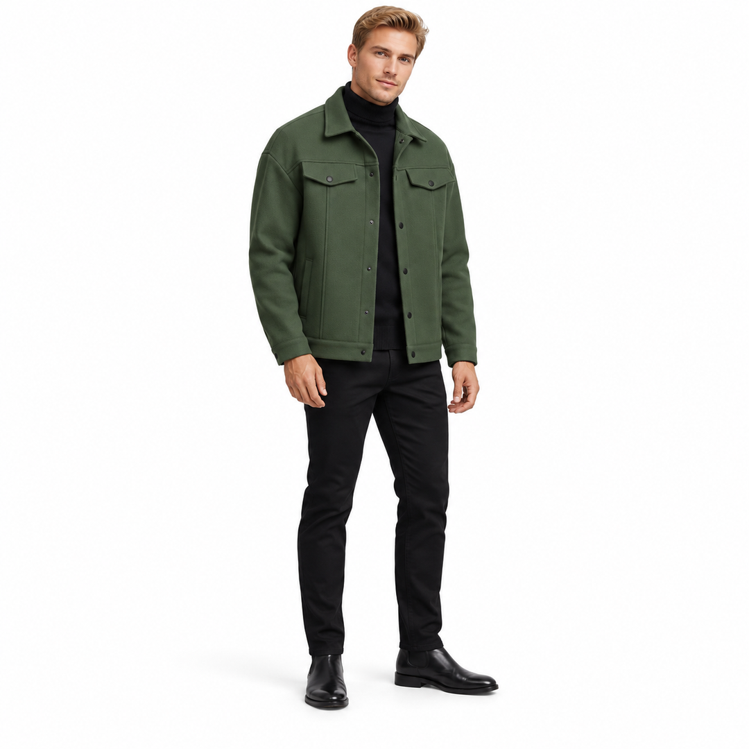 Army green jacket on a full-body blonde adult male model, with a pointed collar, flap chest pockets and black snaps on white.