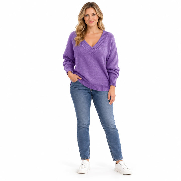 Adult woman modelling the Crystal Purple V-neck knit pullover, in a full-length front view against a white studio background.