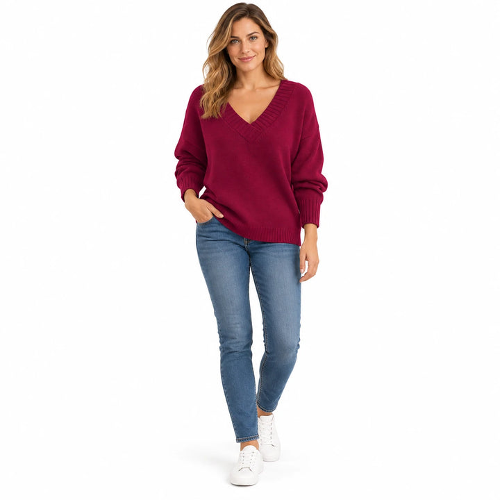 Adult woman wearing the Fresh Jujube Red V-neck knit pullover, in a full-length front view against a white studio background.