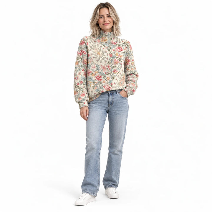 Adult woman wearing the printed high-neck pullover in the Lilac design, in a full-body front view against a white background.