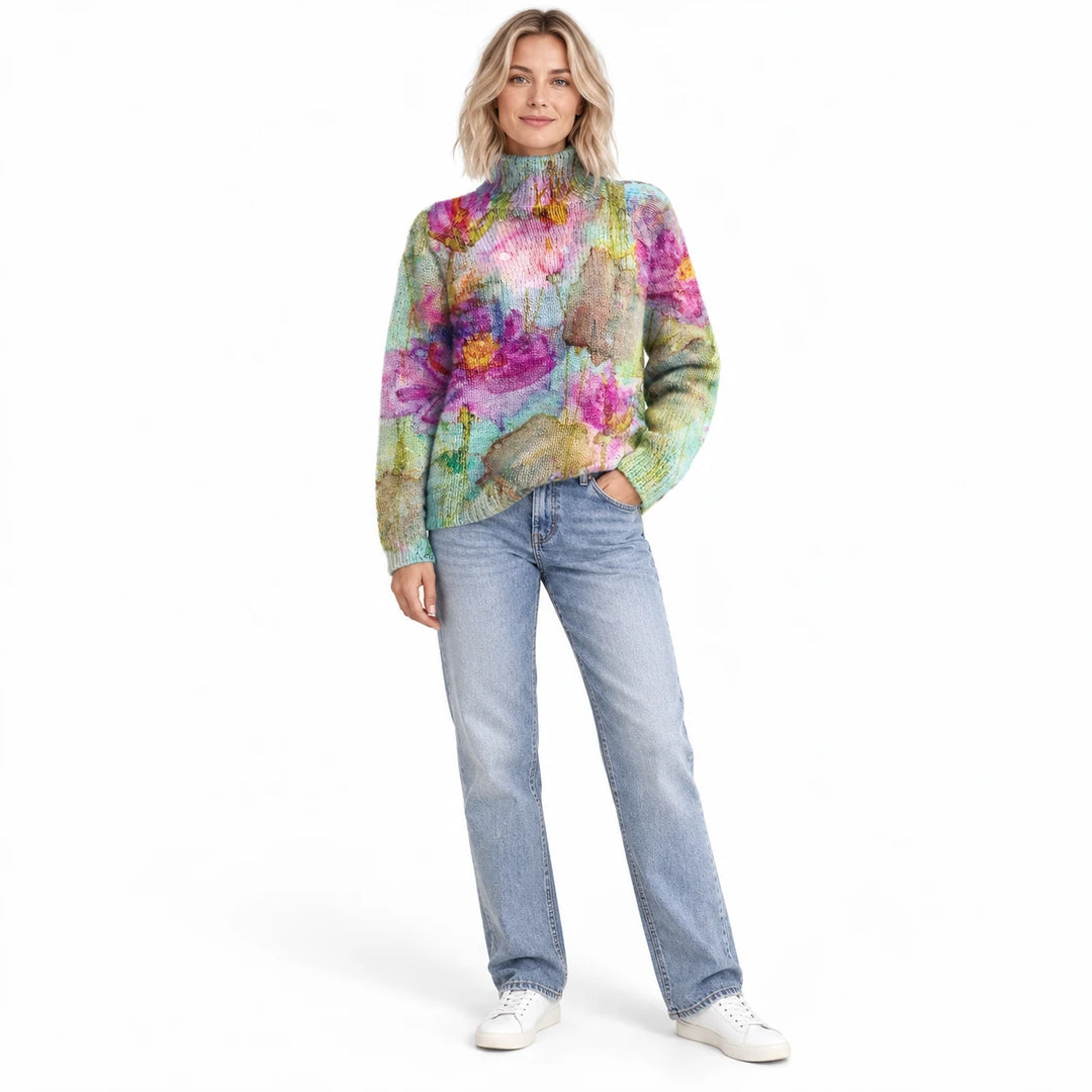Adult woman wearing the printed high-neck pullover in the Indigo design, in a full-body studio view against a white backdrop.