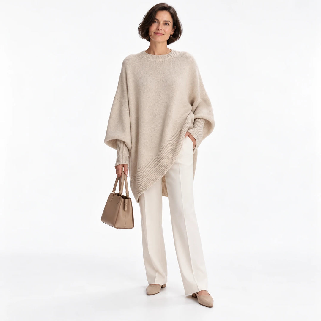 Short-haired adult woman wearing the Apricot 2 round-neck draped pullover, in a front studio pose against a white background.