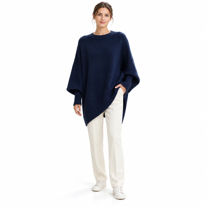 Adult woman wearing the Navy Blue round-neck draped pullover, in a front studio pose against a plain white studio background.