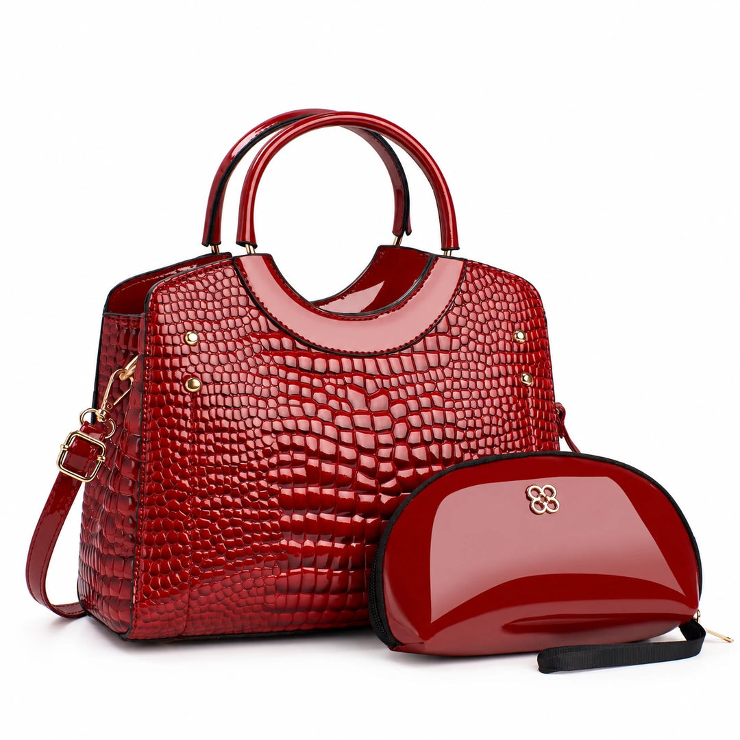 Red textured handbag with double handles and matching pouch on a white background.