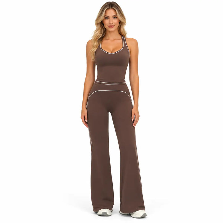 Dark Chocolate Brown two-piece outfit on a full-body model with contrast piping at the neckline, waist and flared pant seams.