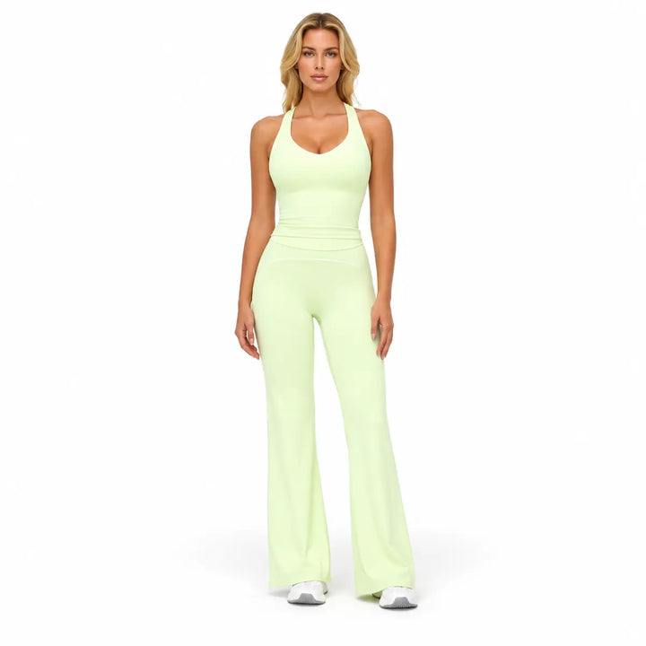 Lime Green two-piece outfit on a full-body model, with a sleeveless V-neck top, curved hip trim and full-length flared pants.