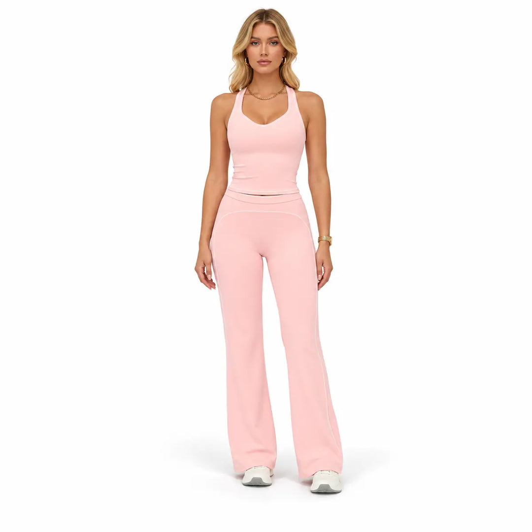 Peach Pink two-piece outfit on a full-body model showing the V-neck sleeveless top, pale piping and full-length flared pants.