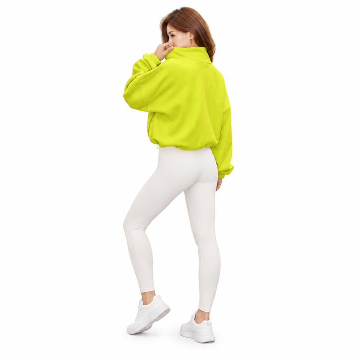 Neon yellow cropped jacket shown from the back on a full-body model, with a raised collar, gathered hem and white background.