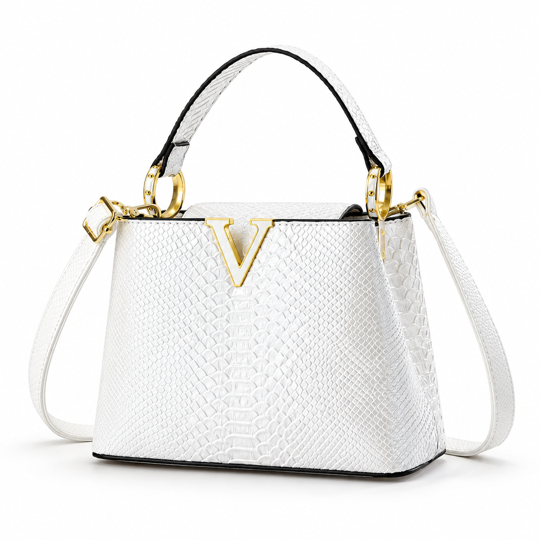 White PU handbag shown in studio front three-quarter view with its embossed finish, top handle gold rings and shoulder strap.