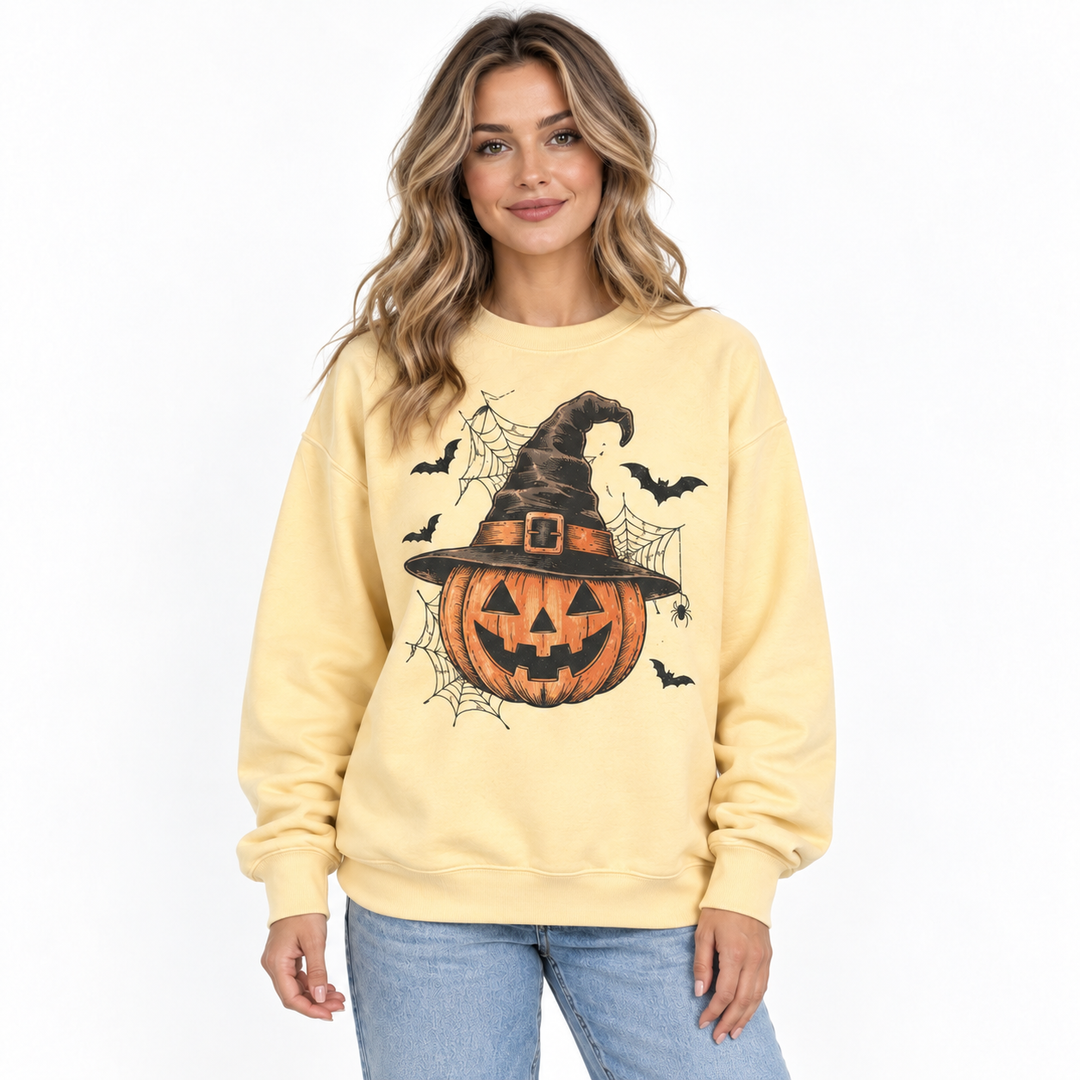 Front view of pumpkin sweatshirt showing witch hat, bats and spider web graphic with ribbed collar, cuffs and hem detail now.