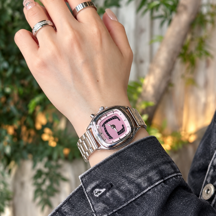 Retro quartz watch pink dial worn on wrist