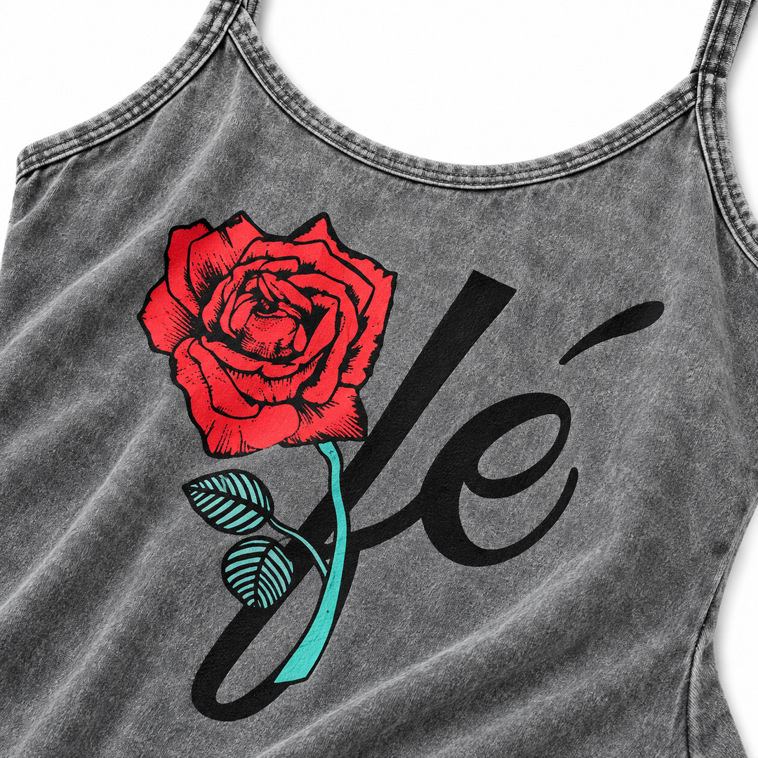 Close-up of red rose and black script graphic on gray washed dress fabric
