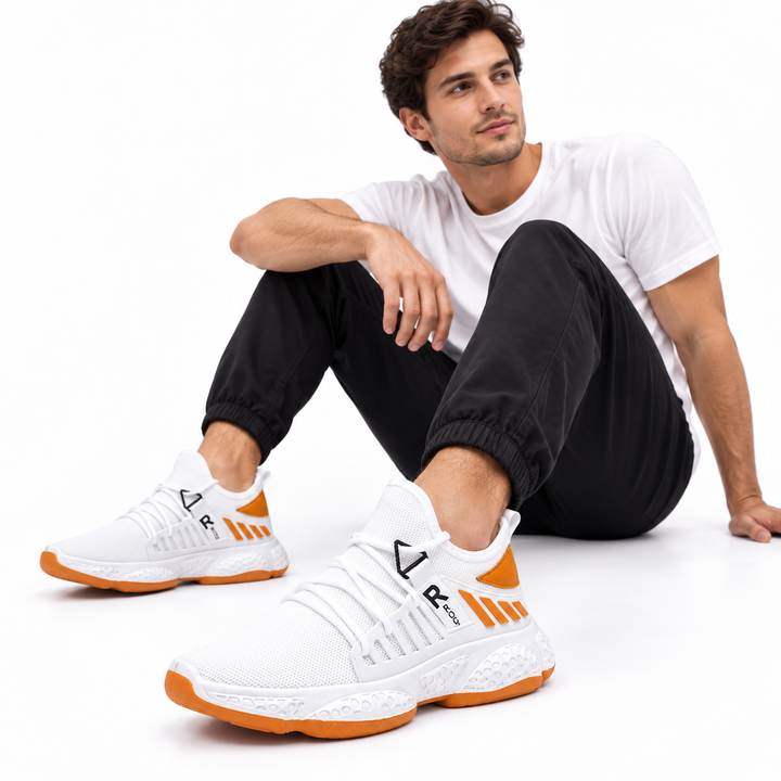 Male model wearing white mesh running shoes with orange accents and textured white EVA soles on a clean white studio background.
