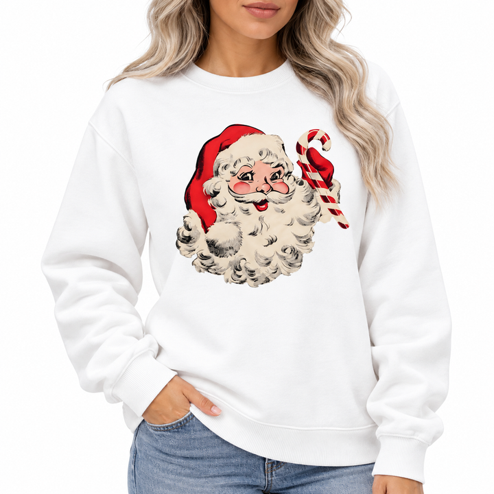 Close-up of Santa Claus and candy cane print on a white crewneck, showing the round neckline, sleeve and ribbed cuff details.