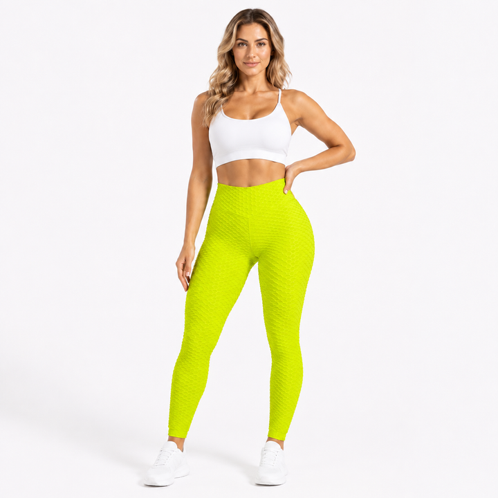 Neon green textured scrunch leggings shown from the front on an adult model, with a high waist and full-length active fit.