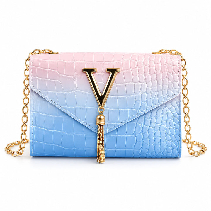 Front view of the blue gradient chain shoulder bag with gold V and tassel