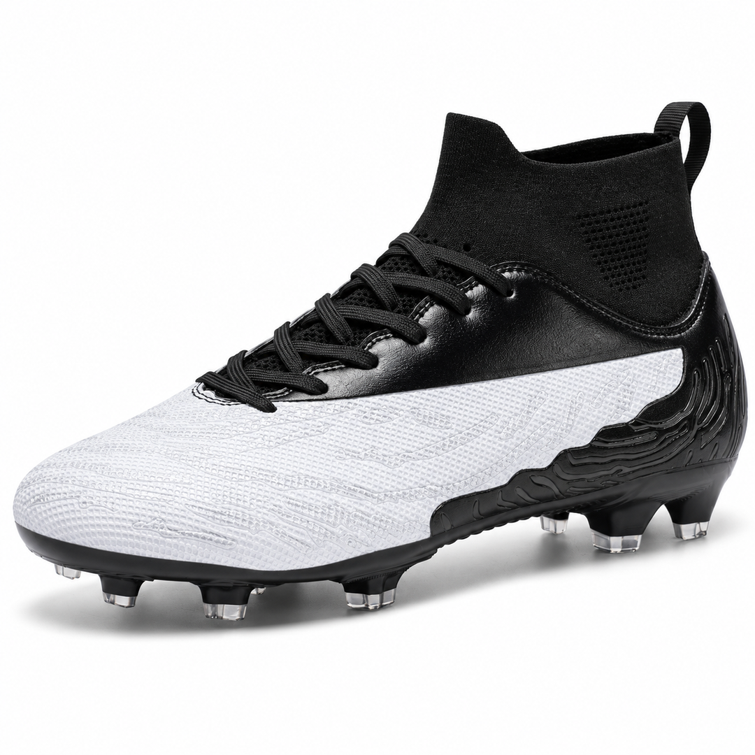 Soccer cleats for sale in white and black, angled studio view showing textured upper, lace closure and molded outdoor studs.